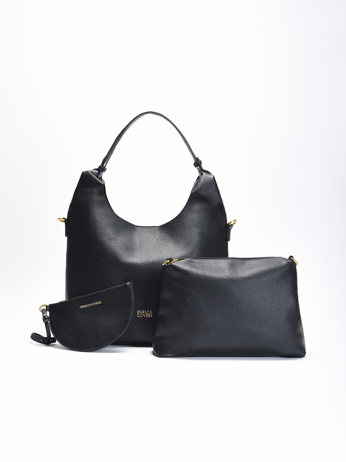 Bolso shopper negro en piel sintética con asas cortas, correa larga ajustable y juego de neceser y monedero a conjunto.